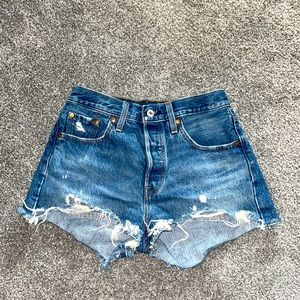 Levi denim shorts. Multiple button front. No zipper